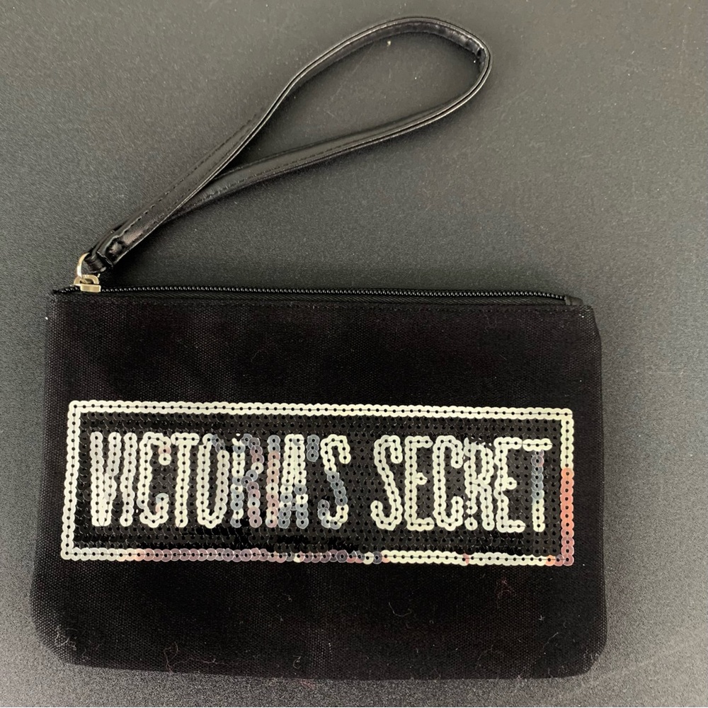 Victoria Secret black with sequins make up bag.